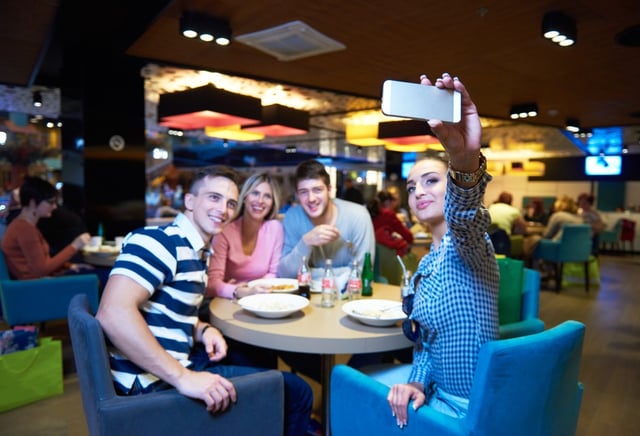 friends have lanch break in shopping mall, eating italian fast food.jpeg